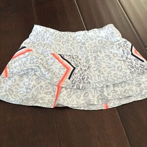 Lucky in love kids tennis skirt size 7–8. In gray Cheetah print.￼